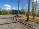 A long driveway leads to a charming home with a two-car garage and lush landscape at 281 Abbott Dr, Canton, GA 30114