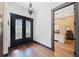 Elegant foyer featuring decorative front door and doorway to office space at 281 Abbott Dr, Canton, GA 30114