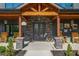 Beautiful home entrance, featuring a stone facade and rocking chairs at 281 Abbott Dr, Canton, GA 30114