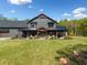 Charming home showcasing a welcoming covered front porch with rocking chairs at 281 Abbott Dr, Canton, GA 30114