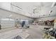 Spacious garage featuring high ceilings with fans and lots of extra storage space at 281 Abbott Dr, Canton, GA 30114