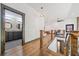 This hallway features hardwood floors, wood railing, and leads to the bathroom at 281 Abbott Dr, Canton, GA 30114