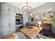Charming home office featuring custom built-ins, a rustic wooden desk, and stylish decor at 281 Abbott Dr, Canton, GA 30114