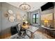 Inviting home office showcasing a window seat, hardwood floors, and modern lighting fixtures at 281 Abbott Dr, Canton, GA 30114