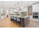 Spacious kitchen with island, stainless appliances, and hardwood floors offers plenty of room to entertain at 281 Abbott Dr, Canton, GA 30114