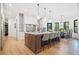 Open kitchen features a large island with bar stool seating and direct access to the dining area at 281 Abbott Dr, Canton, GA 30114
