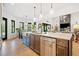 Kitchen island with marble countertop, stainless steel dishwasher, and pendant lighting at 281 Abbott Dr, Canton, GA 30114