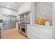 Gourmet kitchen features stainless steel appliances, custom cabinetry, and granite countertops at 281 Abbott Dr, Canton, GA 30114