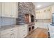 Custom kitchen with high-end stainless steel gas range, granite counters, and beautiful cabinetry at 281 Abbott Dr, Canton, GA 30114