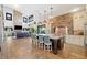 Open floor plan features a large kitchen island, stone accent walls, and seamless connection to the living area at 281 Abbott Dr, Canton, GA 30114