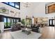 Bright and airy living room with hardwood floors, ample seating, and access to the kitchen and outdoor area at 281 Abbott Dr, Canton, GA 30114