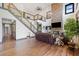 Living room featuring a stone fireplace, hardwood floors, and a staircase leading to the upper level at 281 Abbott Dr, Canton, GA 30114