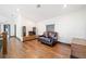 This living room has hardwood floors, a dark sofa, and an entertainment system at 281 Abbott Dr, Canton, GA 30114