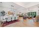 Bright, open-concept living and dining areas with modern lighting and hardwood flooring at 281 Abbott Dr, Canton, GA 30114
