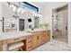 Bright primary bathroom with dual vanities, a walk-in shower, and a vanity with a stool at 281 Abbott Dr, Canton, GA 30114