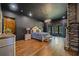 This main bedroom has hardwood floors, a stone fireplace, a chandelier, and plentiful natural light at 281 Abbott Dr, Canton, GA 30114