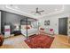 Beautiful main bedroom featuring a four-poster bed, gray accent wall and plenty of natural light at 281 Abbott Dr, Canton, GA 30114