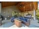 Covered outdoor living space with comfortable seating, a fireplace, and scenic views at 281 Abbott Dr, Canton, GA 30114