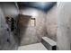 This shower features dark tile, multi-head fixtures, and a built-in bench at 281 Abbott Dr, Canton, GA 30114