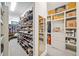 Spacious walk-in closet with custom shelving and ample storage for shoes and accessories at 281 Abbott Dr, Canton, GA 30114