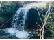 Scenic view of a beautiful waterfall cascading over rocks, surrounded by lush greenery at 281 Abbott Dr, Canton, GA 30114