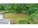 Lush backyard with mature trees, and a wooded area at 3909 Ebenezer Rd, Marietta, GA 30066