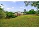 Spacious backyard with a mix of lawn, mature trees, and partial privacy fence offering great outdoor living at 3909 Ebenezer Rd, Marietta, GA 30066