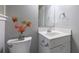 Close up of toilet with flowers in modern bathroom at 3909 Ebenezer Rd, Marietta, GA 30066