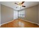Cozy bedroom with hardwood floors, ceiling fan, and closet space at 3909 Ebenezer Rd, Marietta, GA 30066