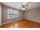 Comfortable bedroom with hardwood floors and a bright window at 3909 Ebenezer Rd, Marietta, GA 30066
