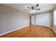 Bedroom with beautiful wood floors, fan, and closet at 3909 Ebenezer Rd, Marietta, GA 30066