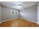 Bright bedroom with hardwood floors, ceiling fan, and natural light at 3909 Ebenezer Rd, Marietta, GA 30066