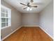 Bedroom with hardwood floors, neutral paint, and ceiling fan at 3909 Ebenezer Rd, Marietta, GA 30066