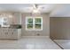Bright dining area with large windows, ceiling fan, and tiled floor adjoining the kitchen at 3909 Ebenezer Rd, Marietta, GA 30066