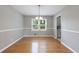 Cozy dining room featuring hardwood floors and a classic chandelier for an elegant touch at 3909 Ebenezer Rd, Marietta, GA 30066