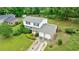 Charming two-story house with a two-car garage, lush landscaping, and a well-kept lawn at 3909 Ebenezer Rd, Marietta, GA 30066