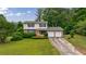 Two-story home with well-manicured lawn and landscaping at 3909 Ebenezer Rd, Marietta, GA 30066