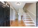 Inviting foyer with hardwood floors, staircase, and neutral paint, creating a warm and welcoming first impression at 3909 Ebenezer Rd, Marietta, GA 30066
