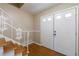 Foyer featuring hardwood floors, white railings, with closet doors offering ample storage and a practical space at 3909 Ebenezer Rd, Marietta, GA 30066