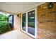 Covered front porch with brick siding, offering a welcoming entrance to the home with great curb appeal at 3909 Ebenezer Rd, Marietta, GA 30066