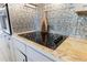Modern kitchen details including stone countertops, stainless appliances, and stylish backsplash at 3909 Ebenezer Rd, Marietta, GA 30066