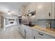 Functional kitchen showing white cabinetry, stainless appliances, and open access to the living area at 3909 Ebenezer Rd, Marietta, GA 30066