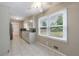 Bright eat-in kitchen features tile floors, ample cabinetry, stainless steel appliances, and natural light at 3909 Ebenezer Rd, Marietta, GA 30066
