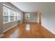 Bright living room with hardwood floors, neutral paint, and large windows, creating a comfortable and inviting space at 3909 Ebenezer Rd, Marietta, GA 30066