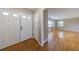 Foyer view into a bright living room with hardwood floors, neutral walls, and natural light streaming in from large windows at 3909 Ebenezer Rd, Marietta, GA 30066