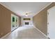 Open living room with tiled floor, decorative fireplace, and double doors leading to backyard at 3909 Ebenezer Rd, Marietta, GA 30066