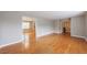 Spacious living room boasting hardwood floors, fresh paint, and easy access to other rooms at 3909 Ebenezer Rd, Marietta, GA 30066