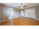 Main bedroom with bathroom, closet, and gleaming hardwoods at 3909 Ebenezer Rd, Marietta, GA 30066