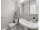 Cozy powder room with stylish pedestal sink and mirrored medicine cabinet at 3909 Ebenezer Rd, Marietta, GA 30066