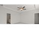 Spacious bedroom with neutral paint, carpet, and tray ceiling with a fan at 488 Village Ln, Fairburn, GA 30213